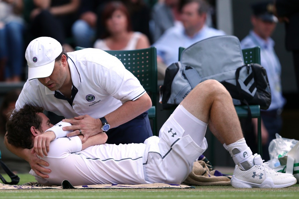 Britain's Andy Murray progressed despite requiring treatment on a shoulder injury