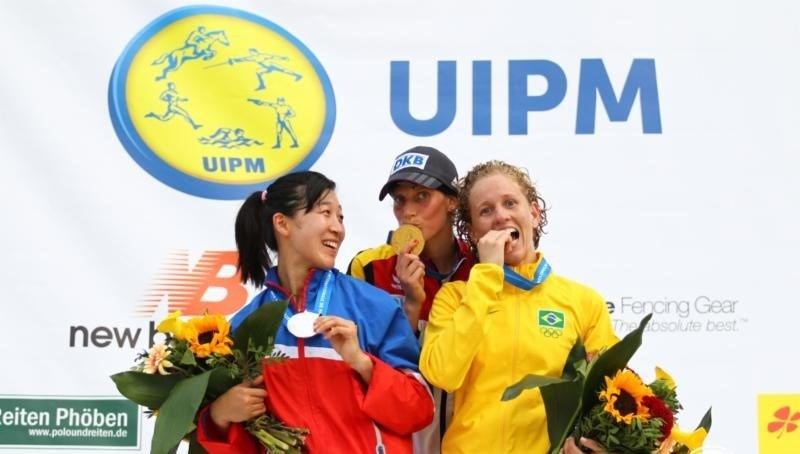 The podlum after the women's individual event at the Modern Pentathlon World Championships in Berlin - winner Lena Schoneborn centre, silver medallist Qian Chen of China (left) and Brazil's Yane Marques