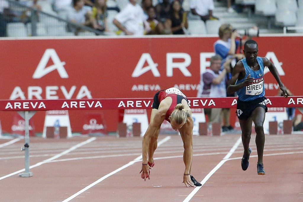 Evan Jager of the United States hits the deck after the final hurdle in the 3,000m steeplechase in Paris before getting back up to run the second best time of 2015 behind Kenya's eventual winner Jairus Kipchoge Birech