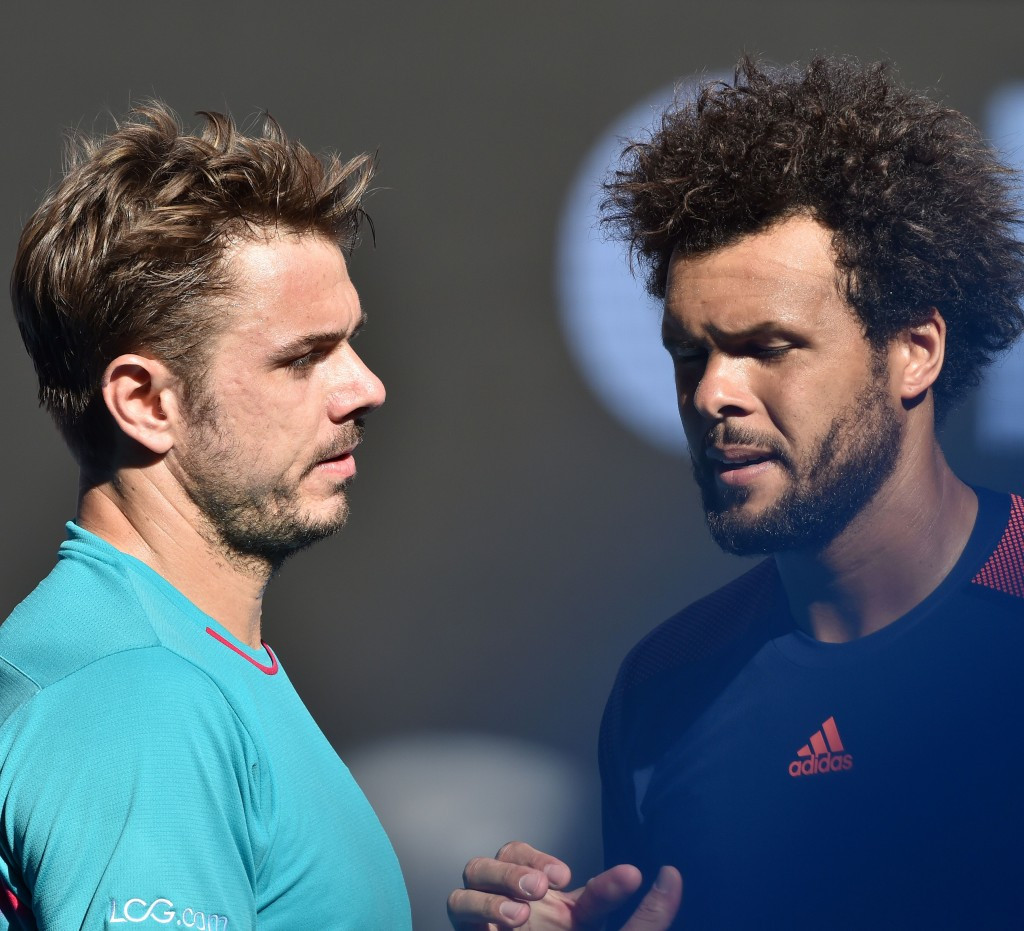 Stan Wawrinka, left, shakes hands with France's Jo-Wilfried Tsonga after the Swiss player won their quarter-final match ©Getty Images