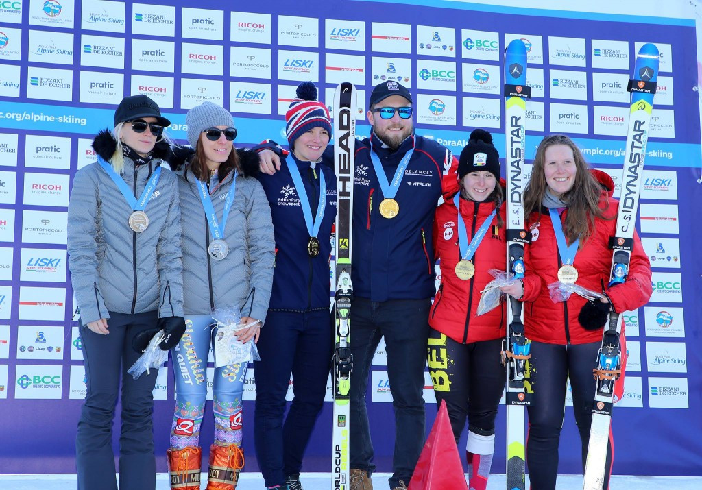 Millie Knight, centre with her guide Brett Wild, won the women's visually impaired title ©Getty Images