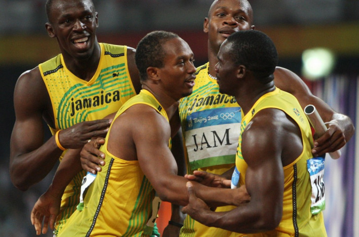Usain Bolt, left, celebrates victory in the 4x100m final at Beijing 2008 with colleagues Michael Frater, second left, Asafa Powell, second right, and, right, Nesta Carter, whose positive drugs test has now annulled the result ©Getty Images