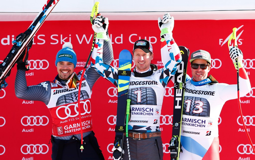 Peter Fill of Italy, left, Austria's Hannes Reichelt, centre, and Swiss skier Beat Feuz celebrate after making the podium in Garmisch-Partenkirchen ©Getty Images
