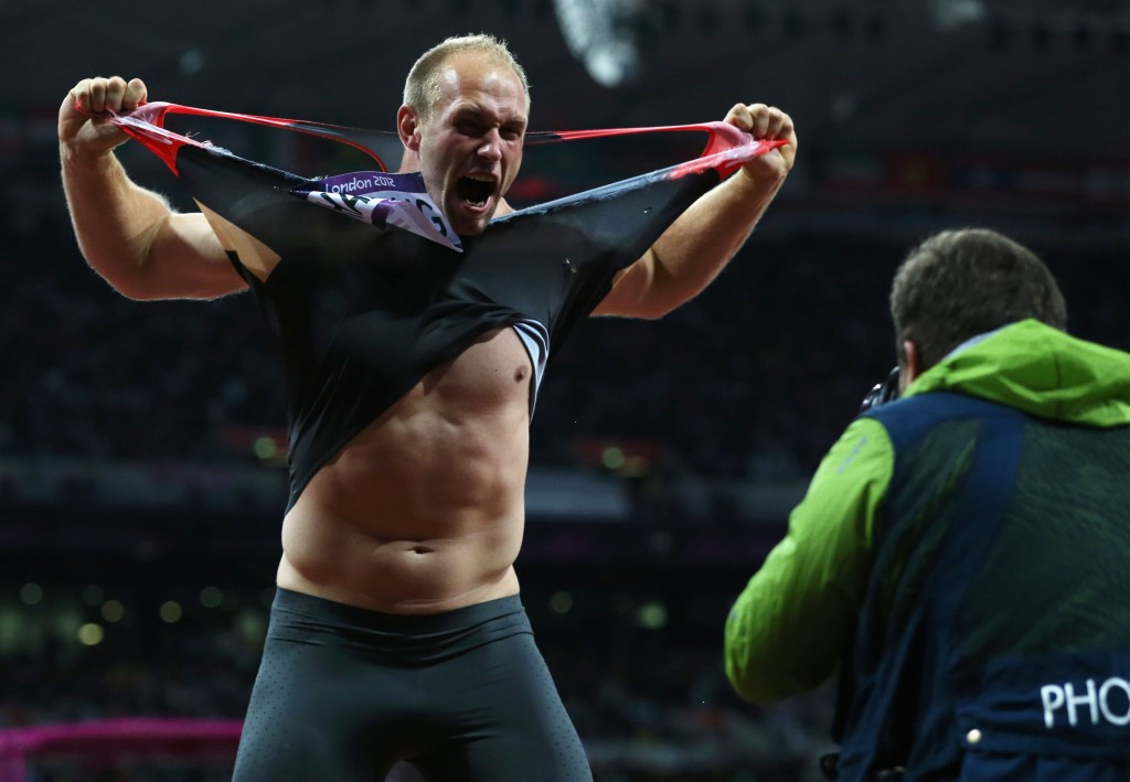 Robert Harting does his famous vest rip after winning gold at the 2012 Olympic Games in London ©Getty Images