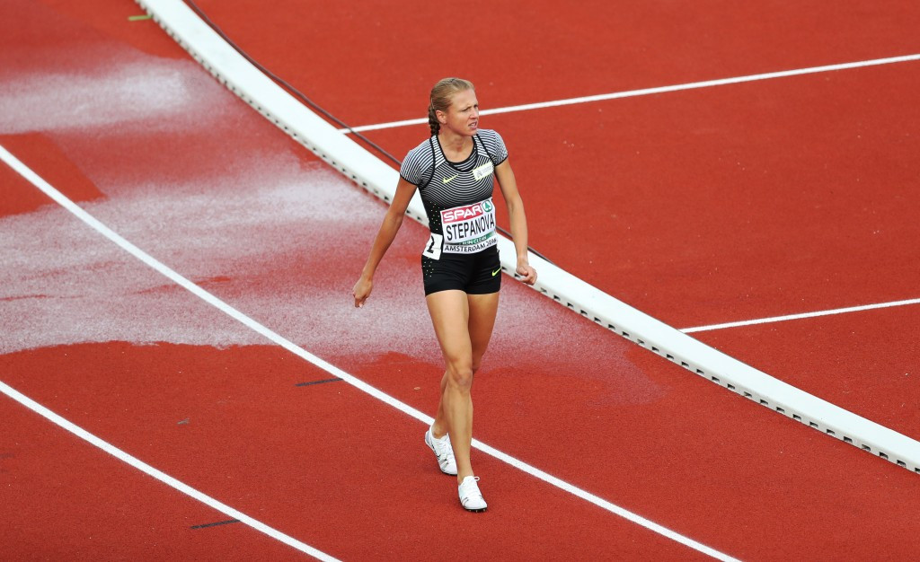 Yuliya Stepanova pictured walking on the track in pain after struggling with injury when competing at July's European Championships in Amsterdam ©Getty Images