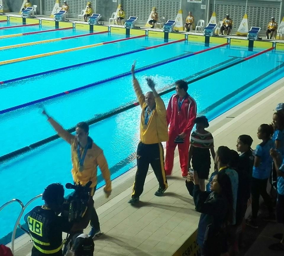 Ryan Pini triumphed in the men's 100m butterfly event to the delight of the home crowd