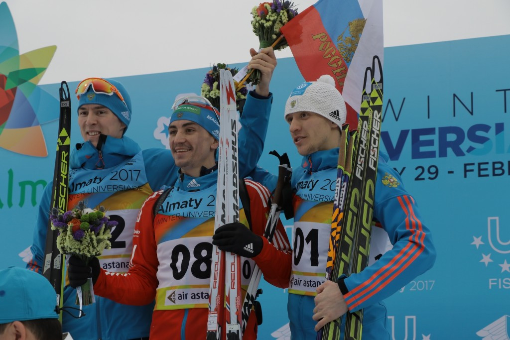 Sergey Korastylev, centre, of Russia claimed the gold medal in the 12.5km pursuit today ©Almaty 2017