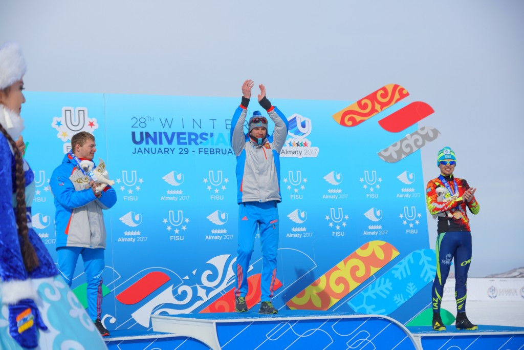 Dmitriy Rostovtsev, centre, claimed victory in the men's cross-country skiing 10km mass start today ©Almaty 2017