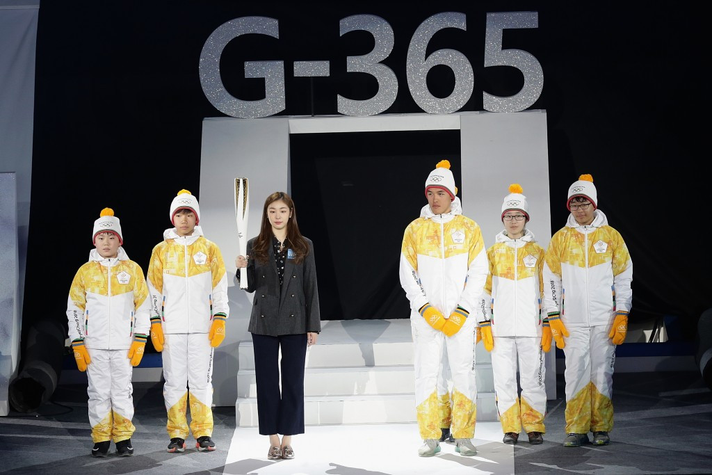Olympic figure skating gold medallist Kim Yuna revealed the Olympic Torch ©Getty Images