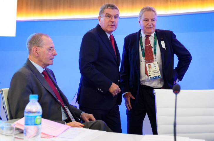 Swiss IOC member and former FISA President Denis Oswald, pictured right during the Rio Games along with the past and present IOC Presidents, Jacques Rogge, left, and Thomas Bach, told FISA delegates in Tokyo that Bach had warned him against an increase in lightweight rowing ©Getty Images
