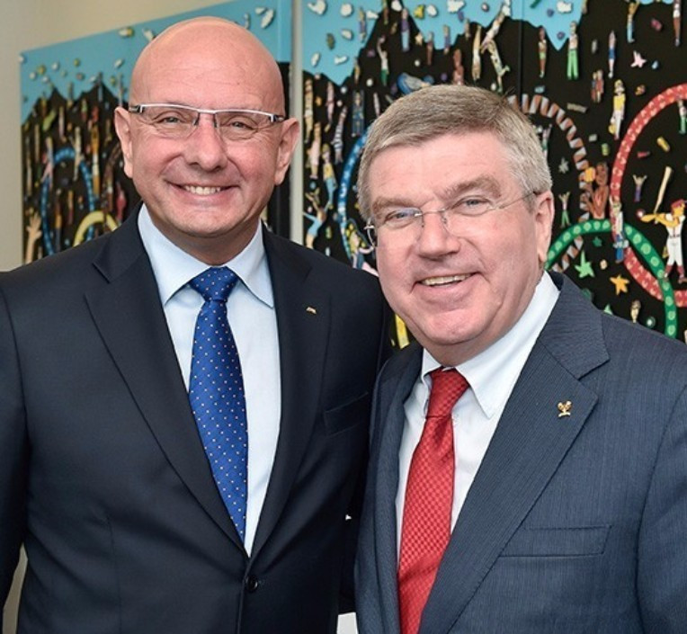 IBSF President Ivo Ferriani, pictured left with IOC President Thomas Bach, is under pressure to act strongly against Russian athletes accused of doping - but he insists more proof is required before judgements are made ©Getty Images
