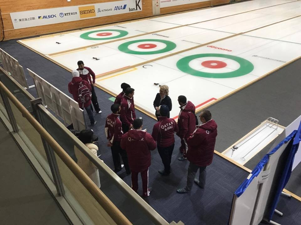 World Curling Federation President Kate Caithness meets the Qatar team after their loss to South Korea today ©ITG