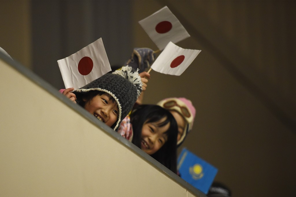 Japanese supporters cheers on their team in the ice hockey opener against Kazakhstan ©Getty Images