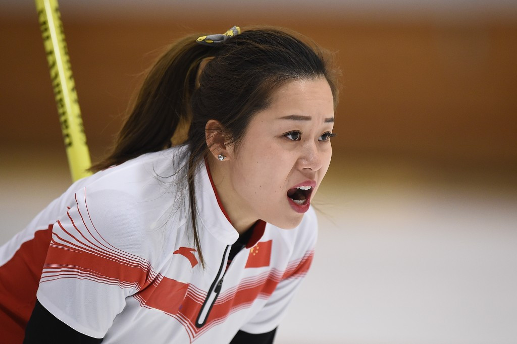 Rui Wang of China roars after launching a stone in the curling competition ©Getty Images
