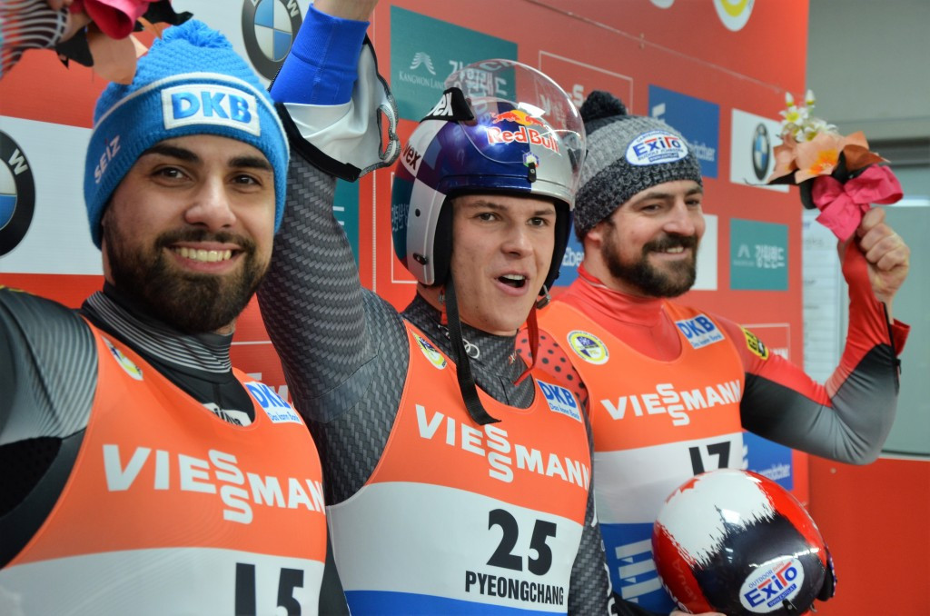 Dominik Fischnaller, centre, won the men’s FIL World Cup competition at the Alpensia Sliding Centre today ©FIL