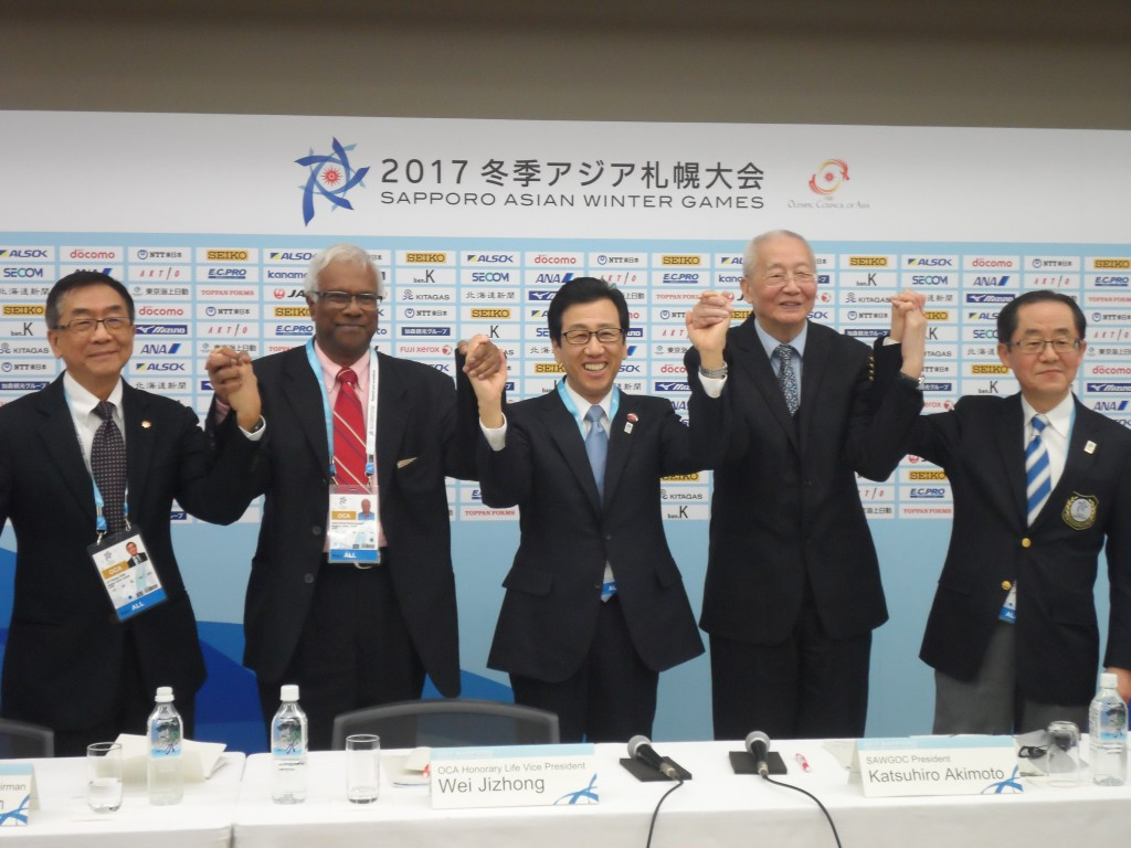 Officials from the Olympic Council of Asia and Sapporo pose following a closing press conference today ©OCA