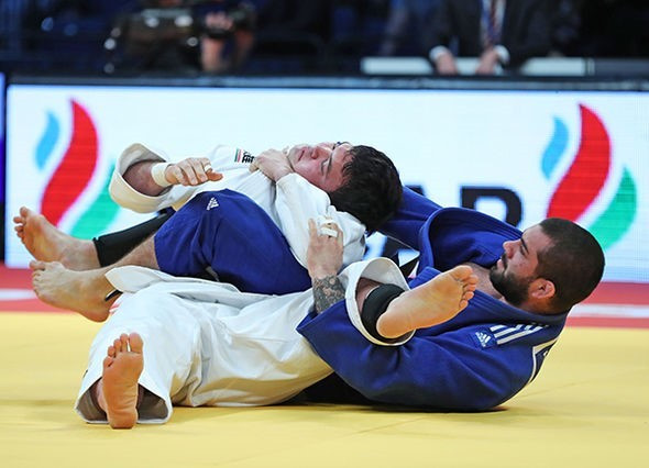 Toma Nikiforov of Belgium, blue, collected his second Grand Prix career victory today ©IJF
