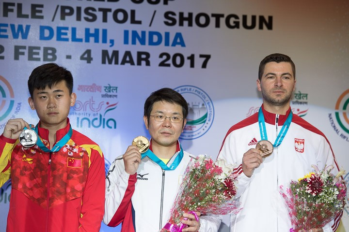 Toshikazu Yamashita, centre, added a second title for Japan today at the ISSF World Cup in New Delhi with victory in the 50m rifle three positions final ©ISSF