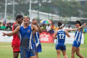 Samoa's players celebrate after beating Papua New Guinea in the mixed touch football final ©Baxter Torie/Port Moresby 2015 