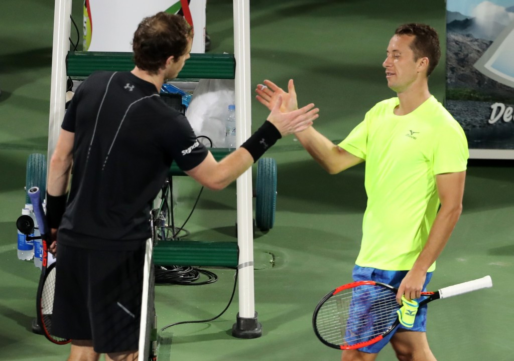 Sir Andy Murray, left, shakes hands with Philipp Kohlschreiber after their encounter at the Dubai Tennis Championships ©Getty Images