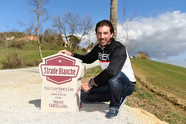 Fabian Cancellara next to the special milestone unveiled in his name along the Strade Bianche course ©Strade Bianche