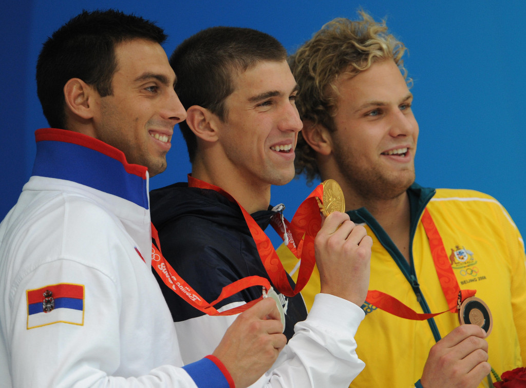 Milorad Cavic, left, and Michael Phelps, centre, pictured alongside Australian bronze medallist Andrew Lauterstein after receiving their 100m butterfly Olympic medals at Beijing 2008 ©Getty Images