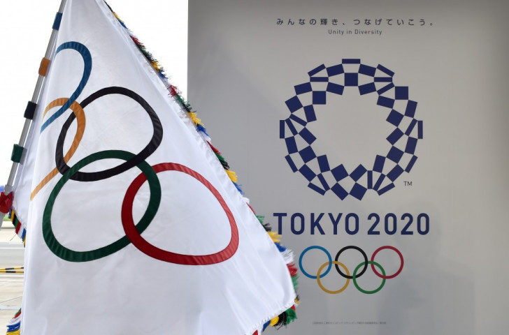 The revised Tokyo 2020 logo, pictured alongside the Olympic flag, arrived after a long and difficult process. Will the process of deciding on the Games mascot, which the public can choose but not name, prove any smoother? ©Getty Images