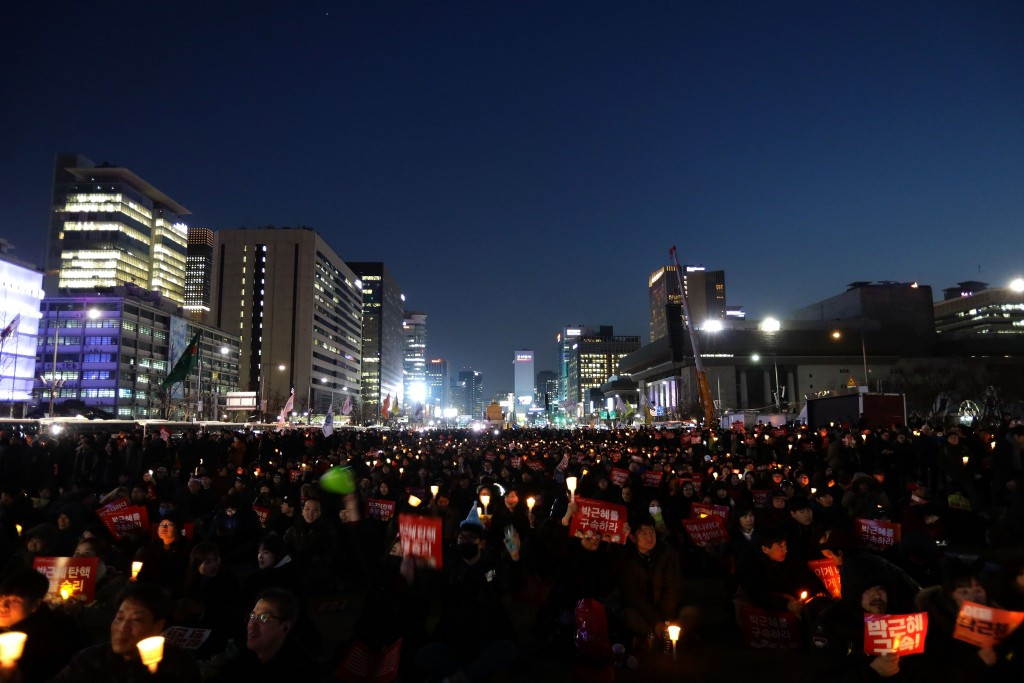 Protesters celebrate the court's verdict today in Seoul ©Getty Images