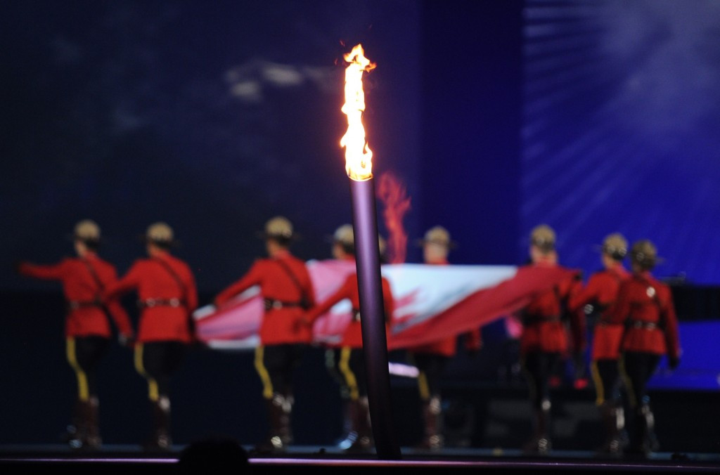 The Canadian flag enters the stage following the iniitial lighting of the Pan American Games Torch ©Getty Images