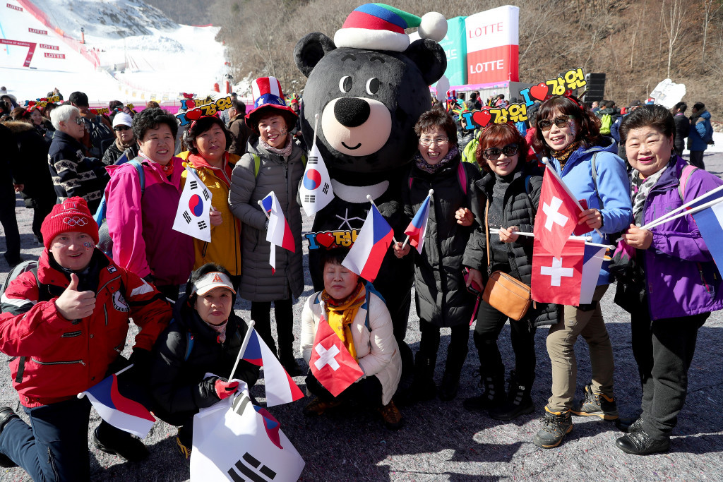Paralympic mascot Bandabi poses with spectators during an Alpine skiing test event earlier this month ©Getty Images