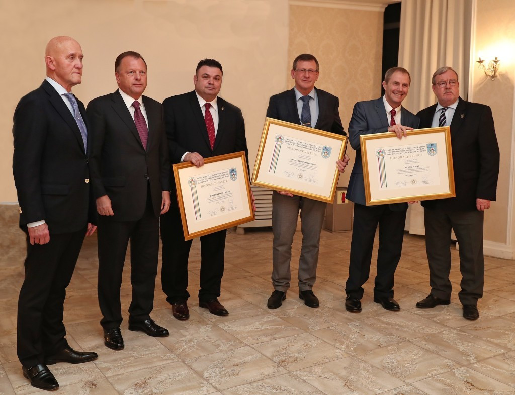 Florin Daniel Lascau, third left, Alexander Jatskevich, third right, and Neil Adams, second right, were all awarded Honorary Referee status by International Judo Federation President Marius Vizer, second left,  ©IJF