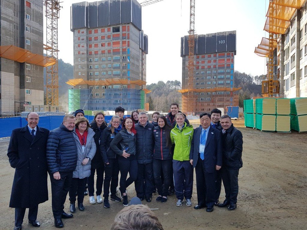 Thomas Bach and other IOC and Pyeongchang 2018 officials pictured alongside skeleton competitors on the Athletes' Village site today ©Twitter/Christian Klaue