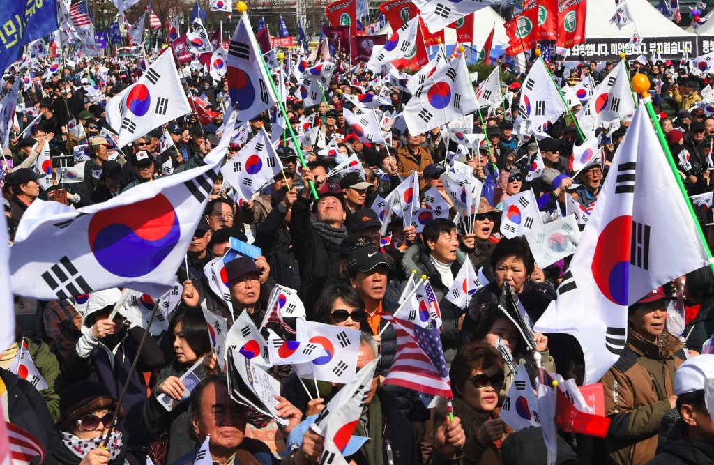 Protesters pictured on the streets of Seoul following the removal of former President Park Geun-hye ©Getty Images
