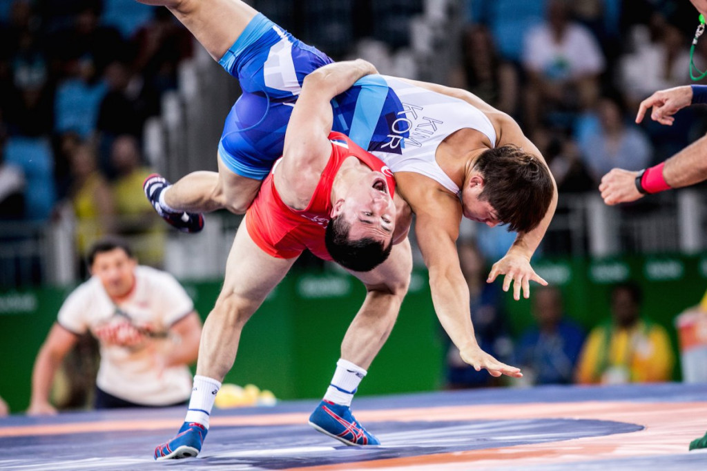 Roman Vlasov, red, leads the Russian team aiming to lift the UWW Greco-Roman World Cup for the first time since 2013 ©UWW