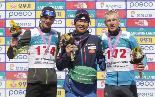 Japan's Yoshihiro Nitta, centre, won the men's standing competition ©Getty Images