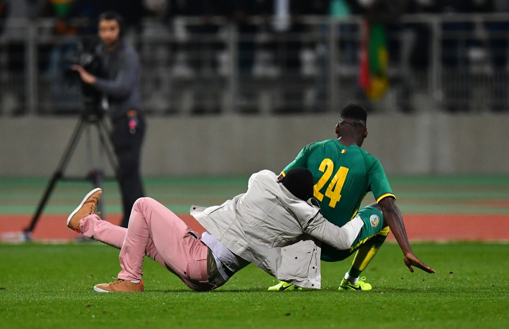 Senegal's Lamine Gassama was rugby tackled by a fan ©Getty Images