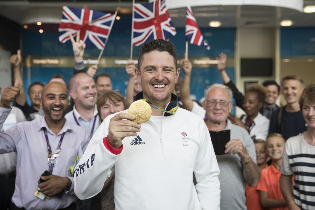 Justin Rose with his Olympic gold medal from Rio 2016. He will be in a group alongside Australia's Jason Day and Brandt Snedeker of the United States for the first two days ©Getty Images