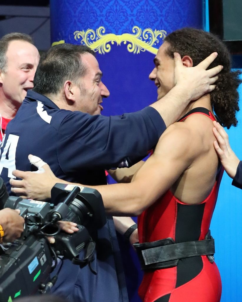 Harrison Maurus, right, is congratulated after his world record breaking effort ©IWF