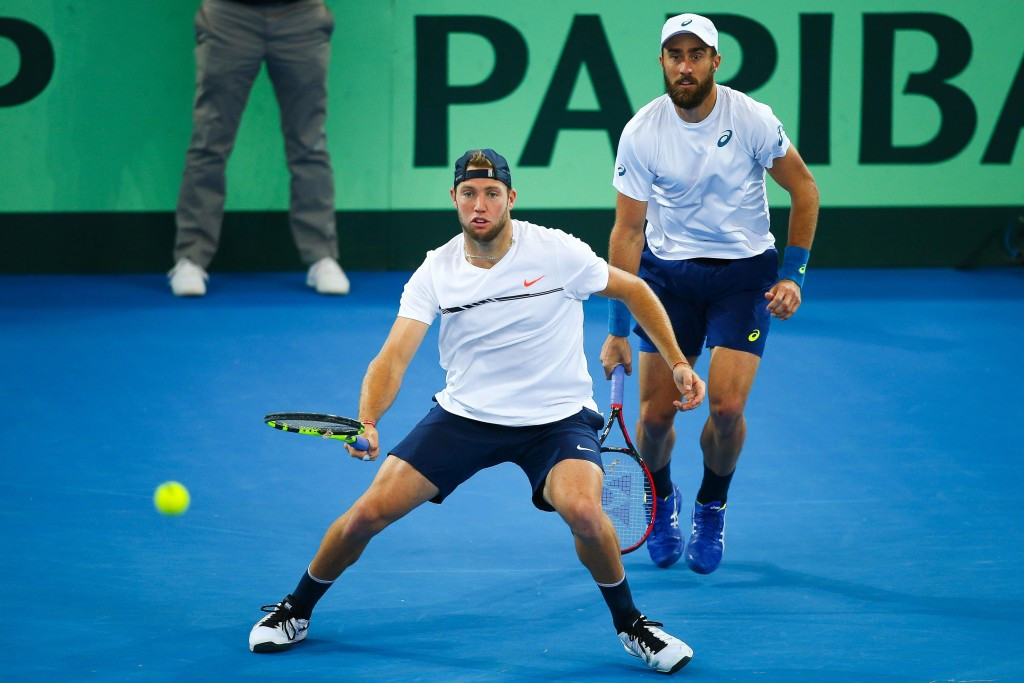 Steve Johnson and Jack Sock weathered a rough start to defeat Sam Groth and John Peers to keep their hopes of progressing alive ©Getty Images