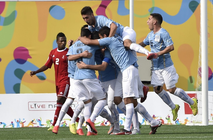 Uruguay celebrate scoring a goal against Trinidad and Tobago in the men's football ©Getty Images