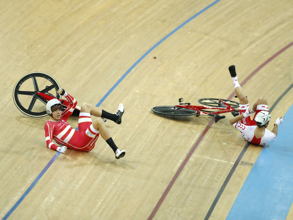 Casper Pedersen of Denmark, left, and Szymon Sajnok of Poland fall to the track during the omnium elimination race ©Getty Images