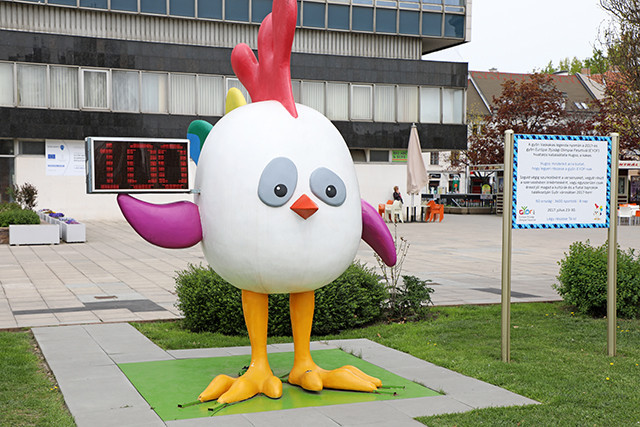 A countdown clock held by the event’s mascot Hugoo is today showing the landmark moment ©Győr 2017