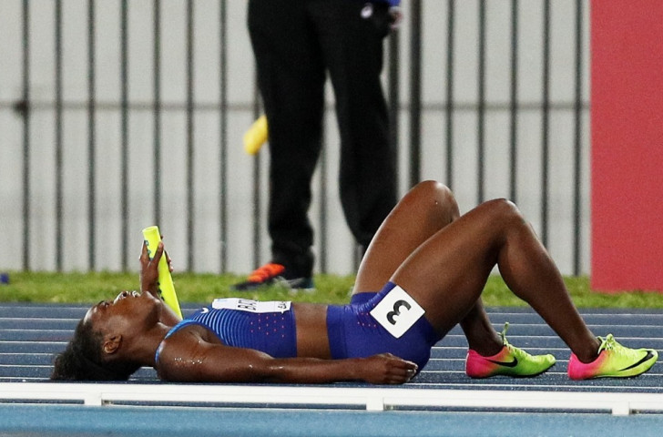America's Olympic long jump champion Tianna Bartoletta fell on a track made slippery by earlier rain as she took the baton in the women's 4x100m in Nassau ©Getty Images for IAAF
