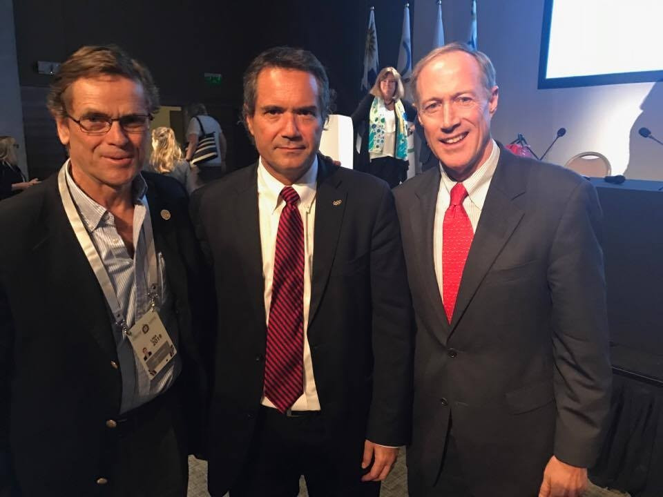 Neven Ilic flanked by secretary general Ivar Sisniega, right, and Lima 2019 President Carlos Neuhaus, left ©ITG