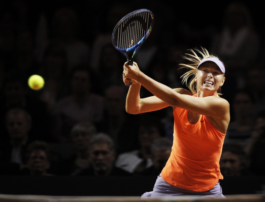 Bouchard hits out at "cheater" Sharapova as Russian continues comeback