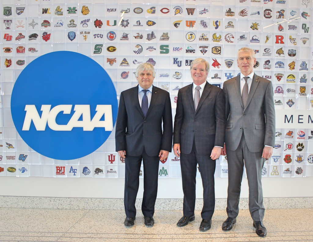 FISU President Oleg Matytsin, right, and NCAA President Mark Emmert, centre, with FISU secretary general Eric Saintrond at the NCAA’s headquarters ©FISU