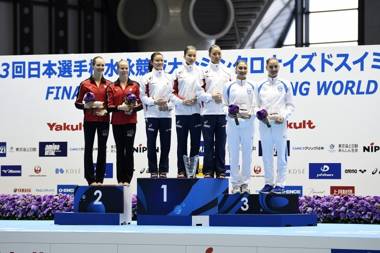 Japan, centre, also won the team event with a score of 184.7684 ©FINA