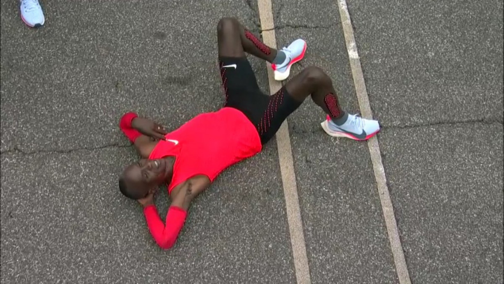 Eliud Kipchoge, Kenya's Olympic champion, briefly takes the weight off on the Monza track after running a 2:00:25 marathon as part of Nike's controversial Breaking2 project ©Twitter