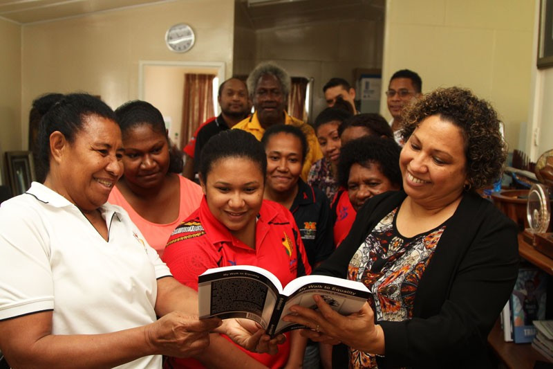 PNGOC secretary general presented with book on equality