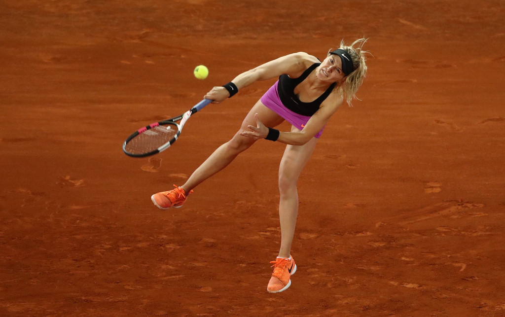 Bouchard beats rival Sharapova in thriller at Madrid Open